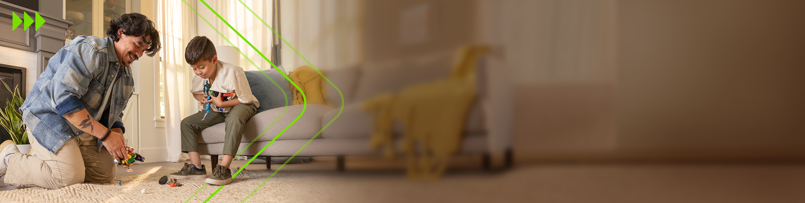 Man playing with figurines with his son in the family room